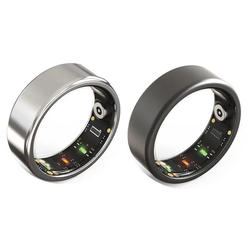 Two Smart Heart Rings, one silver and one black, are shown side by side. Each ring features inner sensors and electronics for heart rate tracking and sleep monitoring.